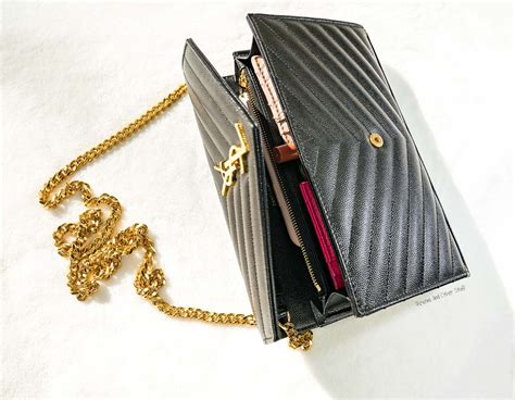 ysl wallet on a chain.